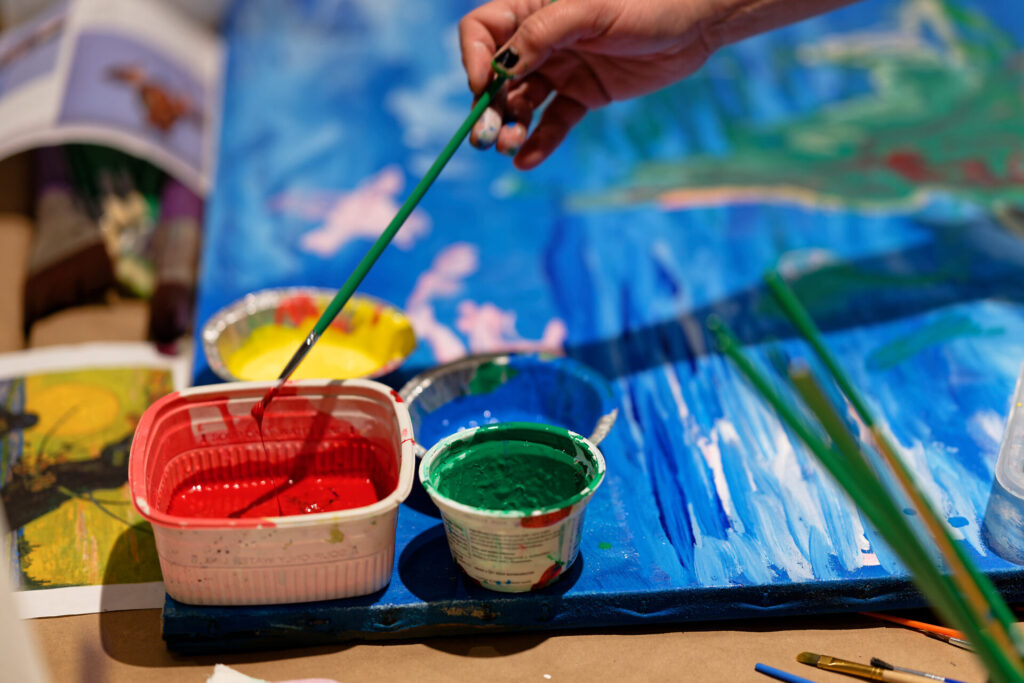 Painting activity during a family art workshop