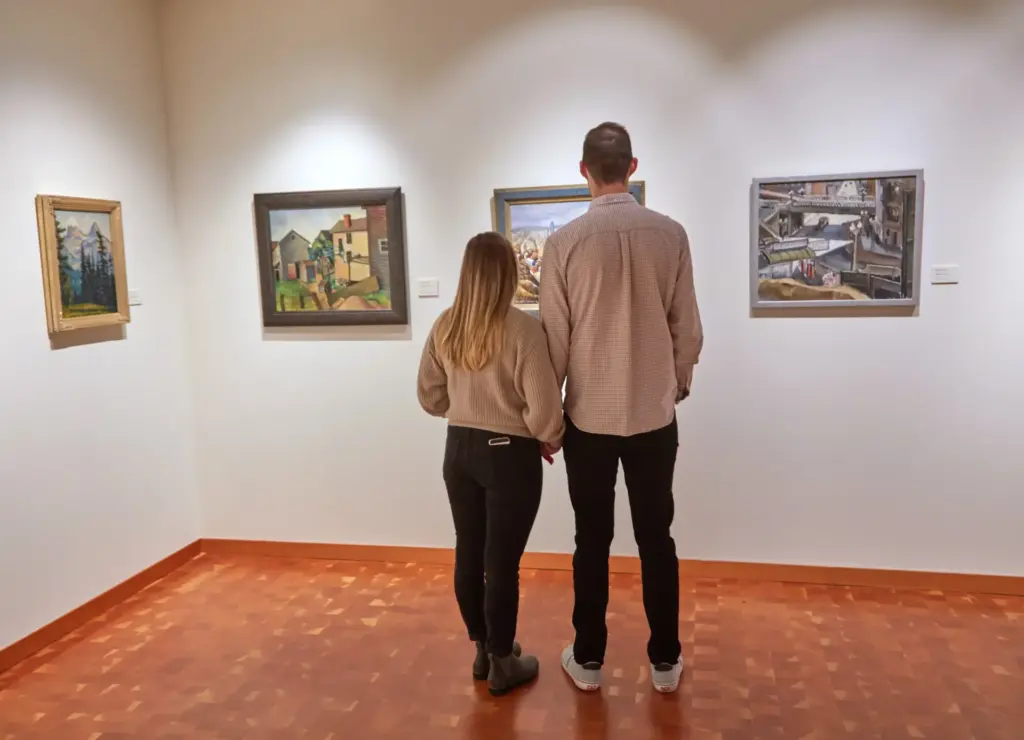 Visitors exploring a Pacific Northwest art gallery