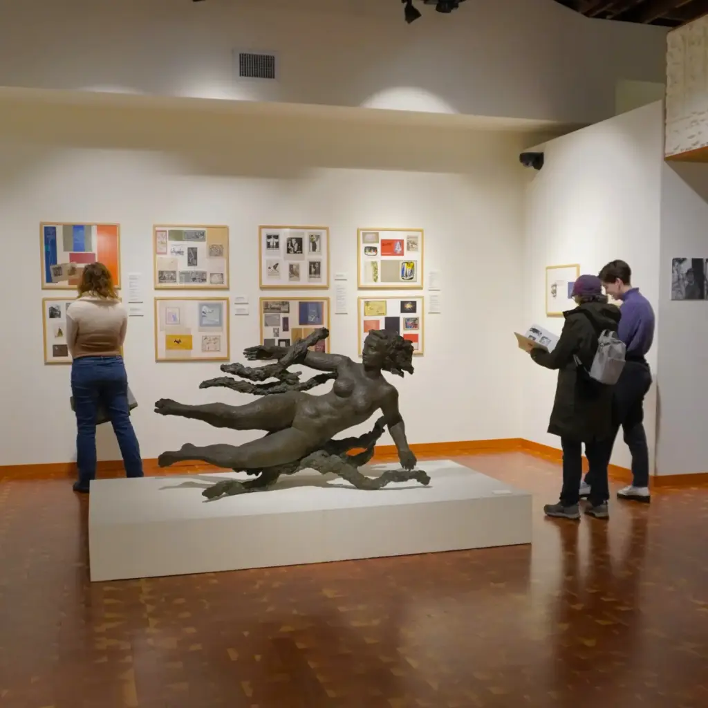 Visitors exploring Pacific Northwest artwork and sculpture