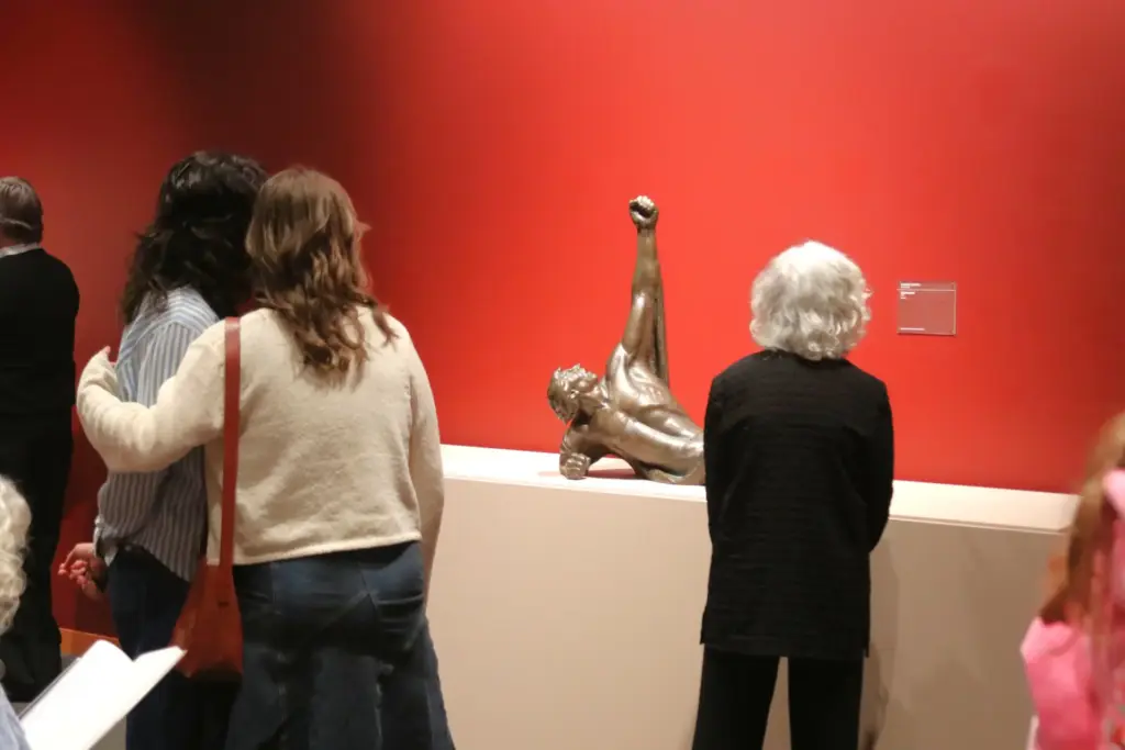 Visitors viewing Pacific Northwest sculpture