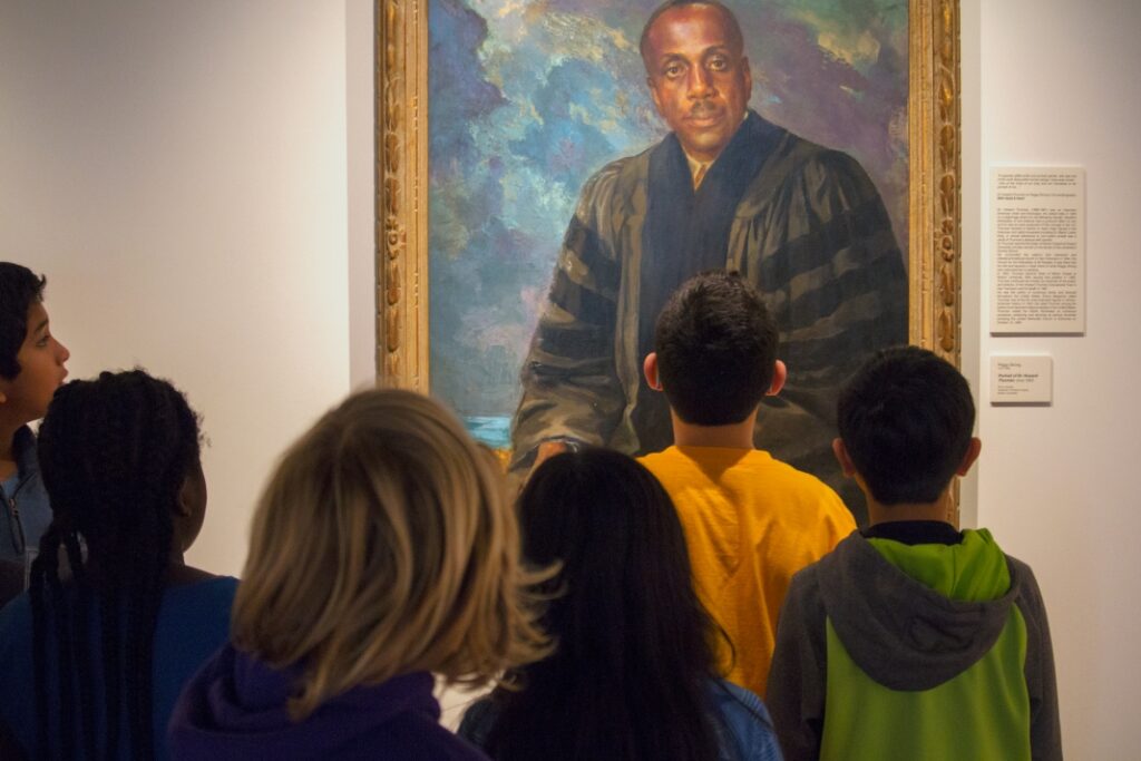 Visitors viewing a portrait at Cascadia Art Museum